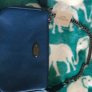 A blue coach purse